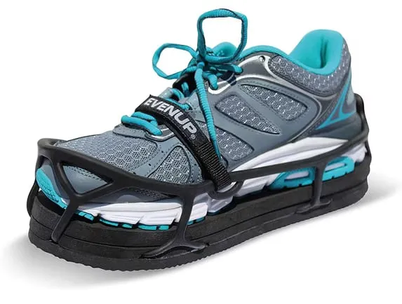 Running shoe strapped into an EvenUp shoe balancer with layered foam soles