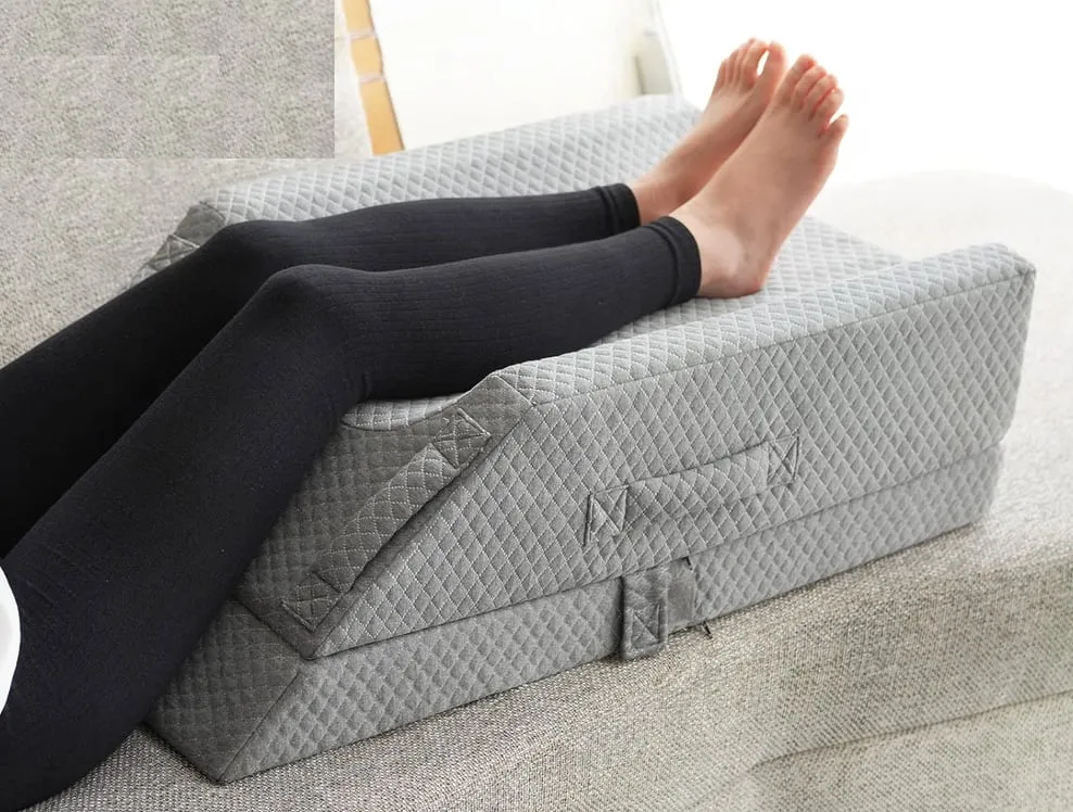 Foam leg elevation wedge pillow with a raised channel for the legs